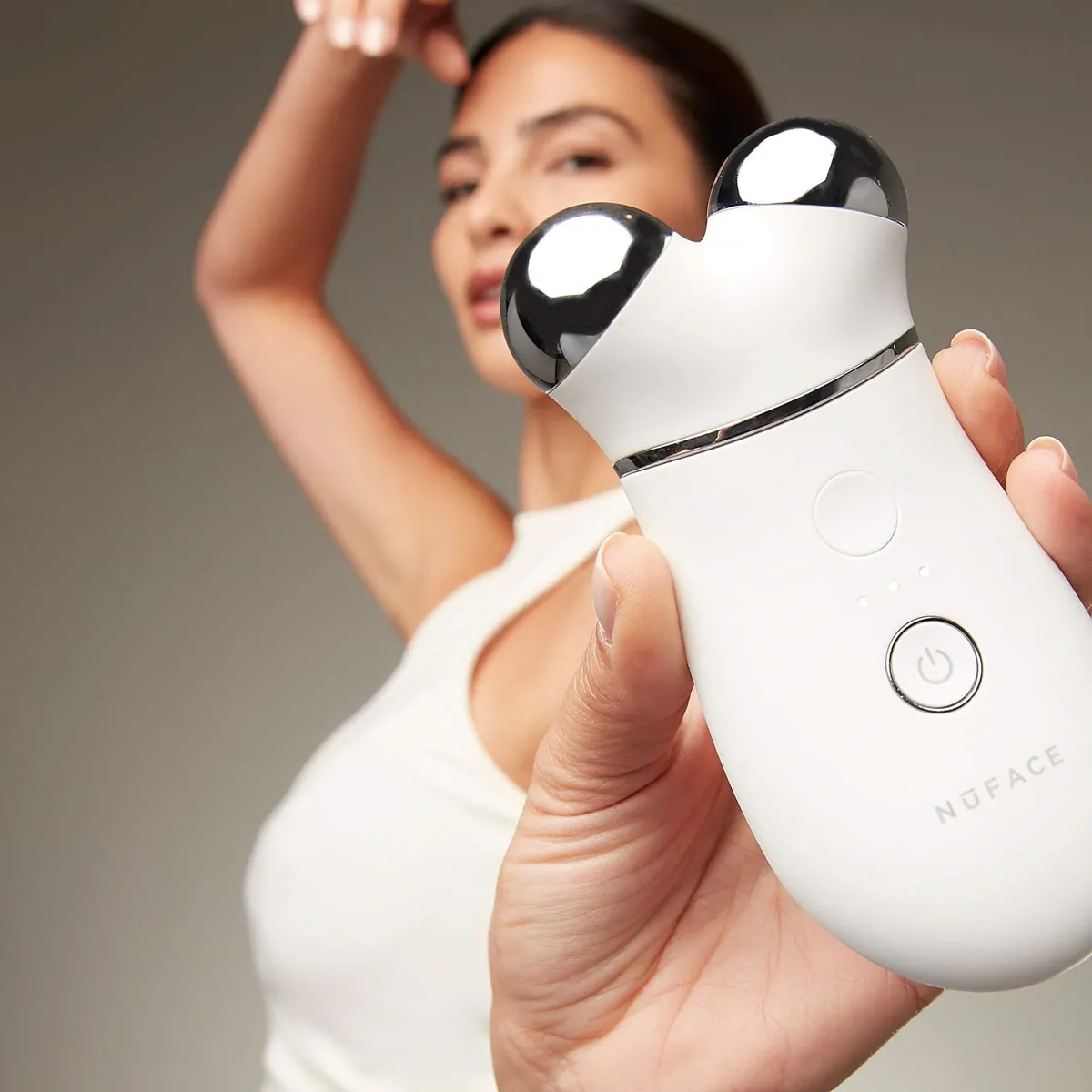 NuFACE TRINITY+ Starter Kit lifestyle photo showing the product in use