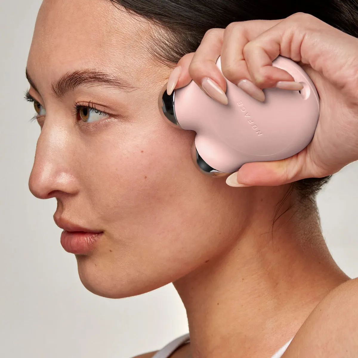 NuFACE MINI+ Starter Kit lifestyle photo showing the product in use